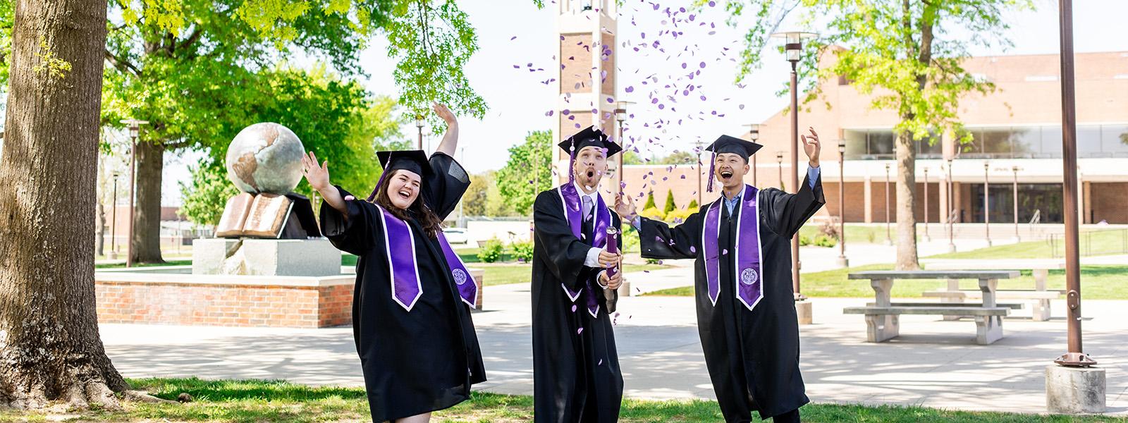 Honors Program celebrating graduation with confetti. 