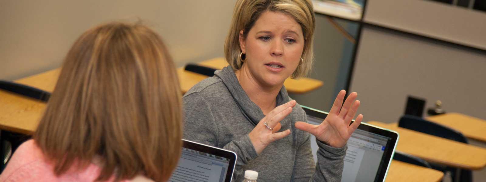 students in discussion in classroom